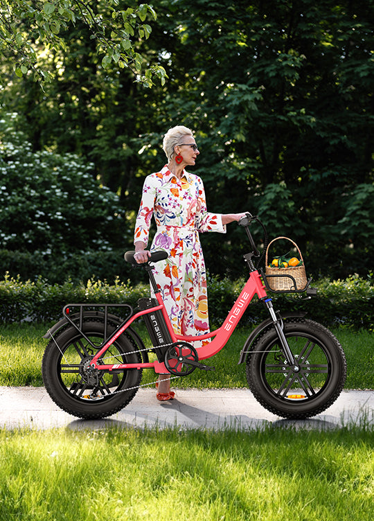 a woman standing next to a engwe l20 women's step through bicycle